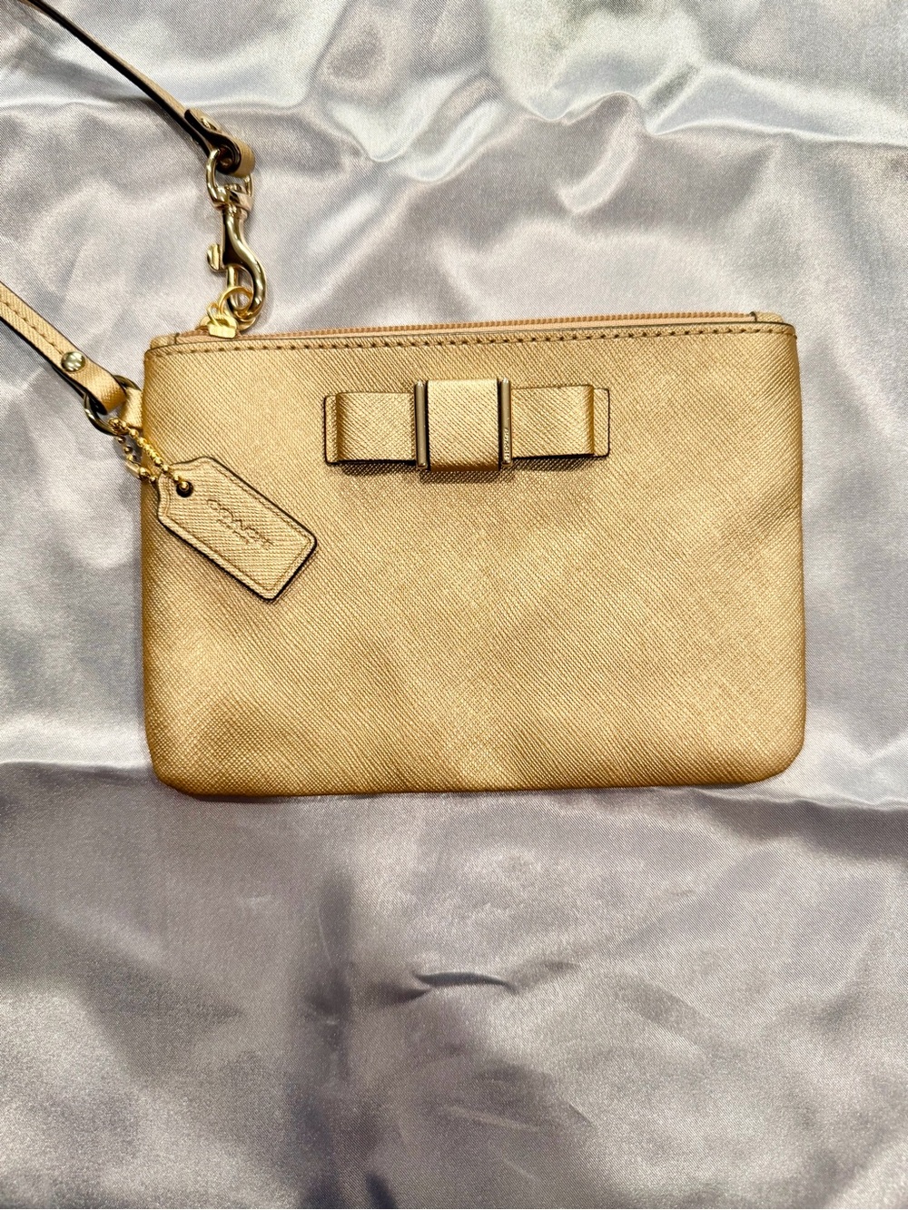 EUC - Coach Darcy Bow Wristlet Metallic Gold Saffiano Leather F51672